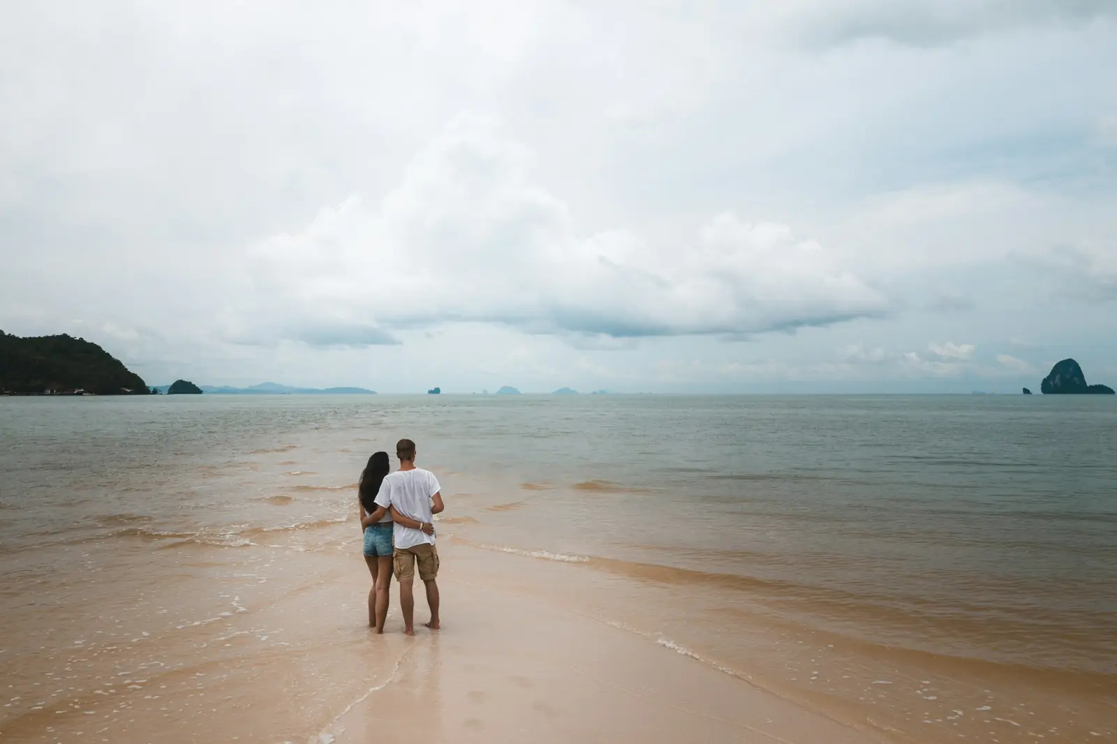 A couple on a quiet Thai beach